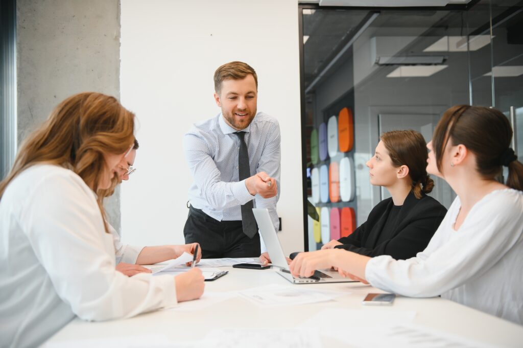 Office manager having meeting with staff
