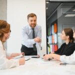 Office manager having meeting with staff